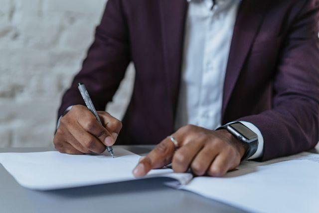 A person signing a lease agreement